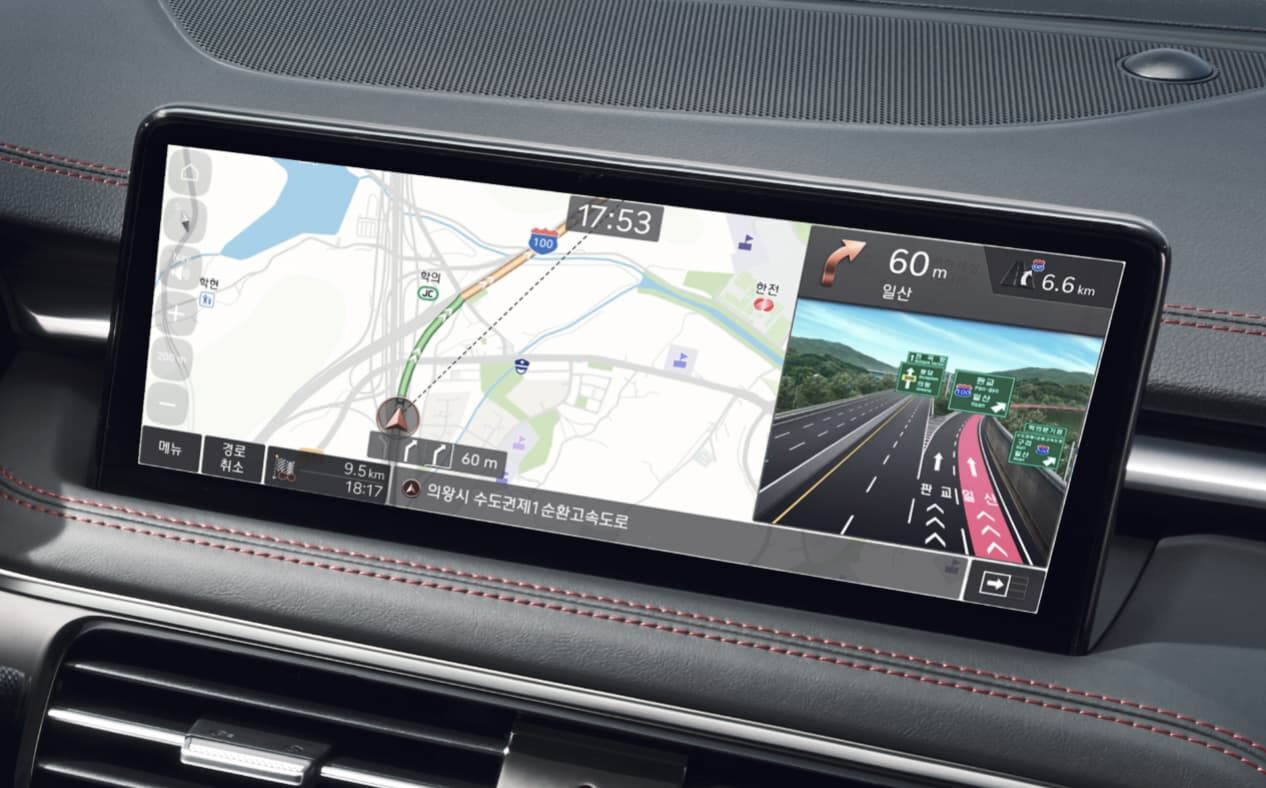 Navigation and highway driving support for the driver are visible on the infotainment display.