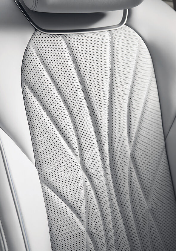 The light gray GV70 leather seats are magnified.